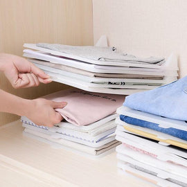 Creative clothing storage folding board